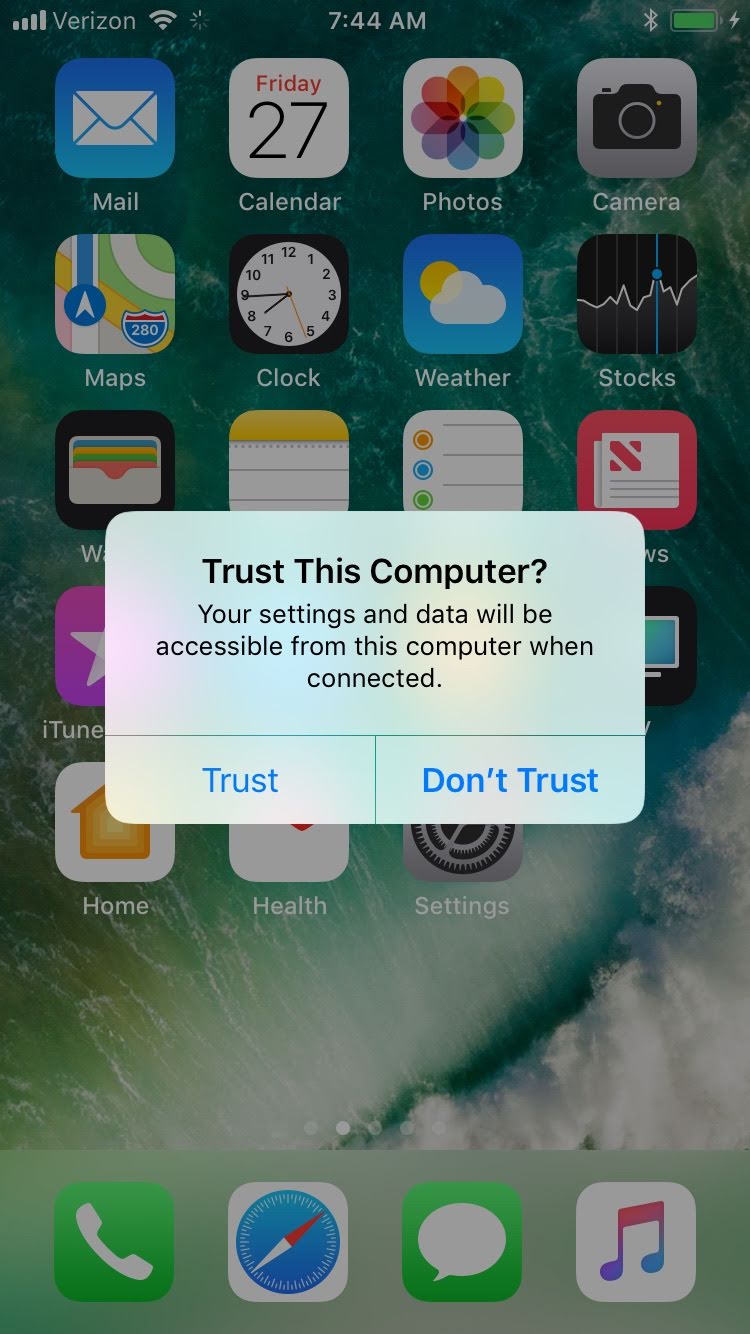 On dialogue pop up that says Trust This Computer? Dialog asking the user to confirm that they want iOS to trust the connected computer.