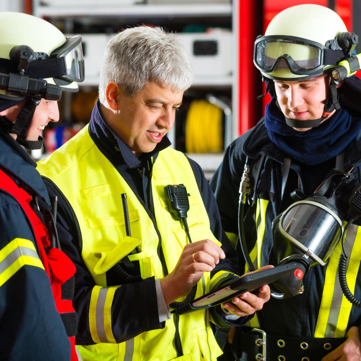 First responders viewing a tablet