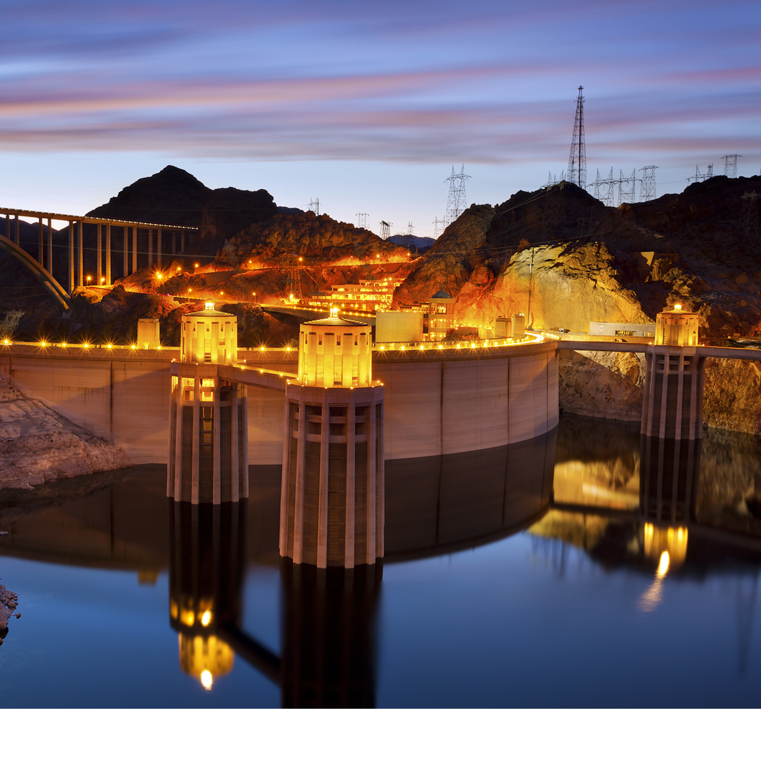 A photograph of a hydroelectric dam at night.