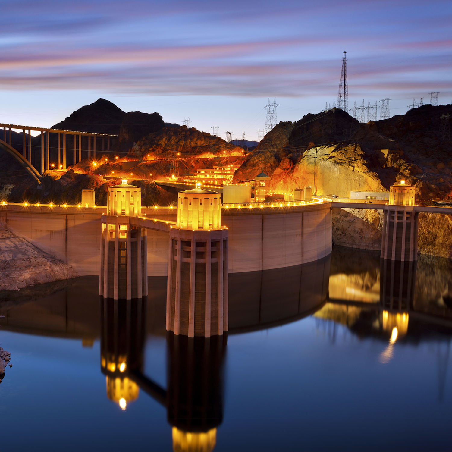 A photograph of a hydroelectric dam at night.