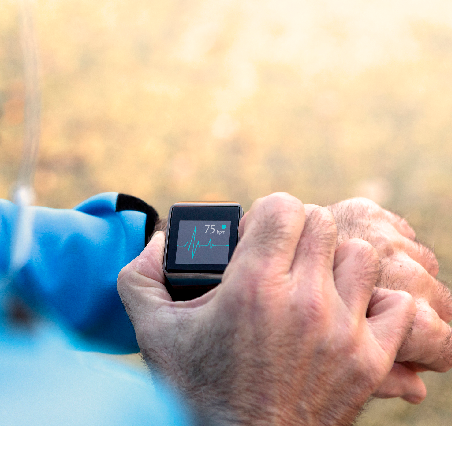 Photograph of a person using a wearable biometric device.