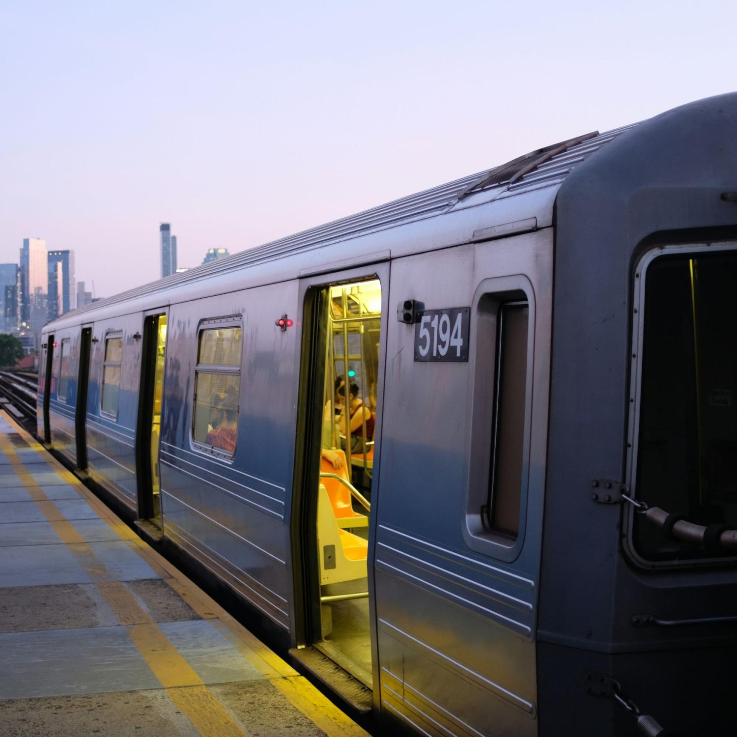 Train with a city skyline.