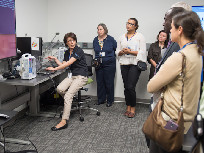 A photo of an NCCoE engineer giving a demonstration in the Healthcare lab.
