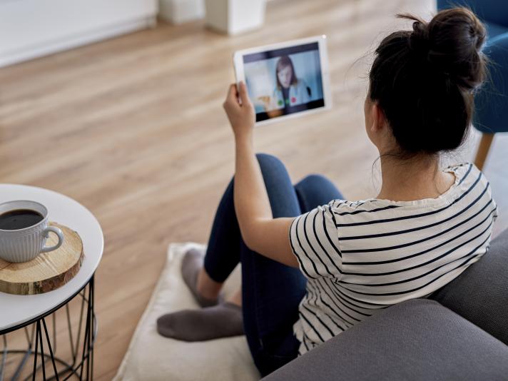 A person having a video conference with their doctor