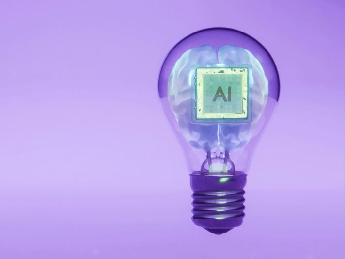 Lightbulb displaying "AI" with a purple background.