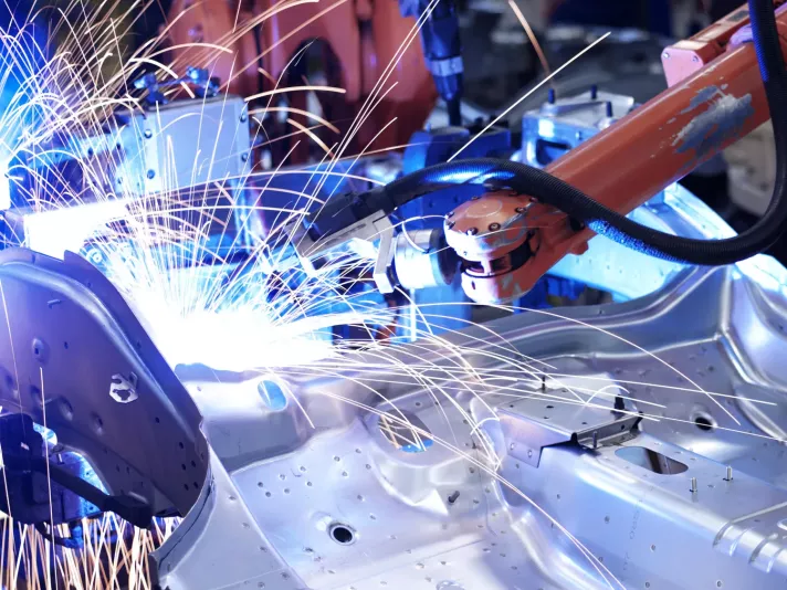 Robot in a manufacturing environment.