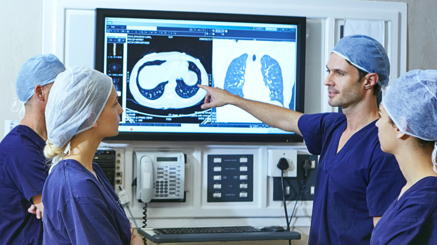 A photograph of medical professionals viewing x-rays.